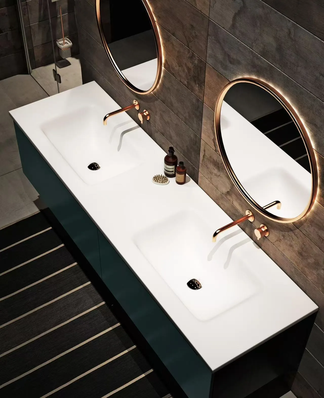 Minimalist white cast marble double sink basin with chrome faucets against a dark grey architectural background.