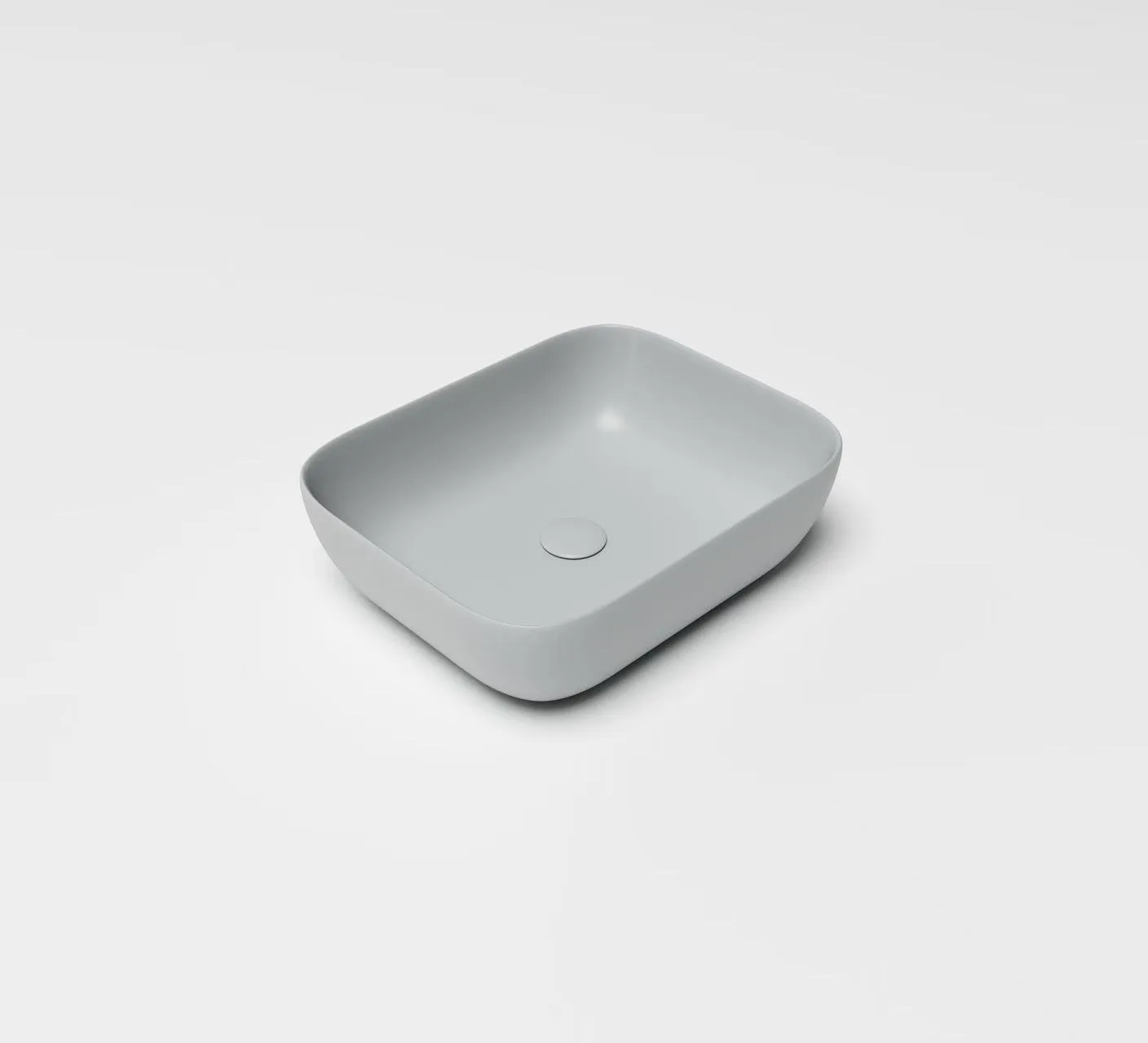 Light grey Rectangular Vessel Solid Surface Sink showing a seamless homogenous structure and soft rounded corners for easy commercial maintenance.