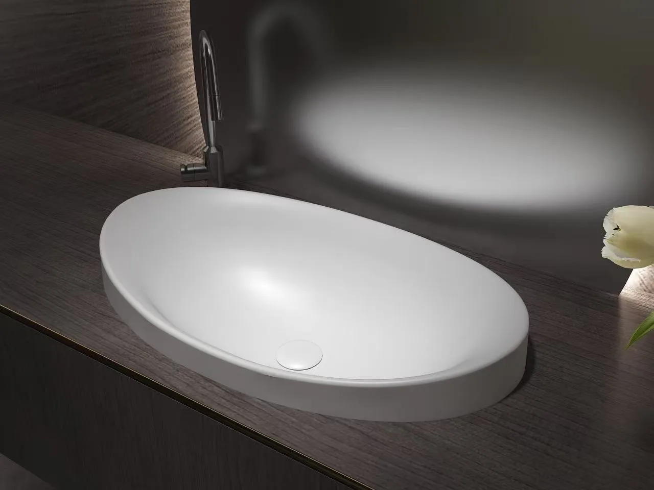 Dark grey oval solid surface sink demonstrating HONDAO's advanced color matching capabilities for modern commercial spaces.