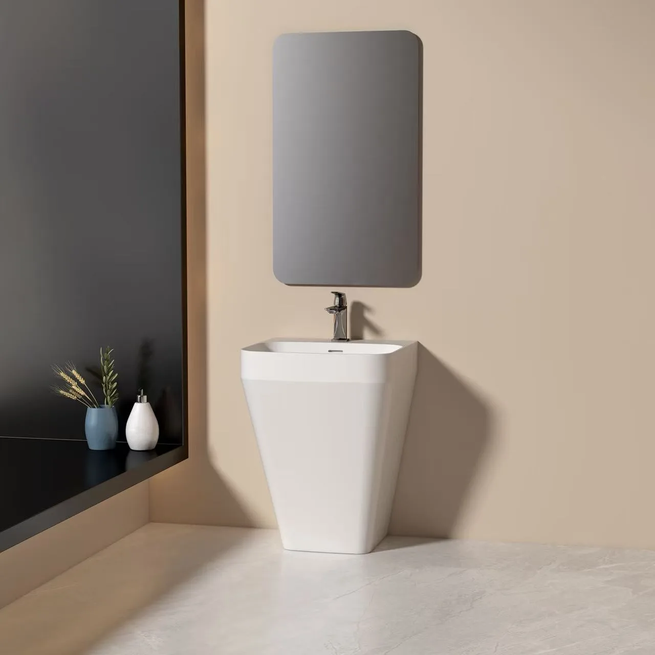 Flat-back freestanding solid surface sink installed flush against a wall in a luxury boutique hotel half-bath with an illuminated mirror.