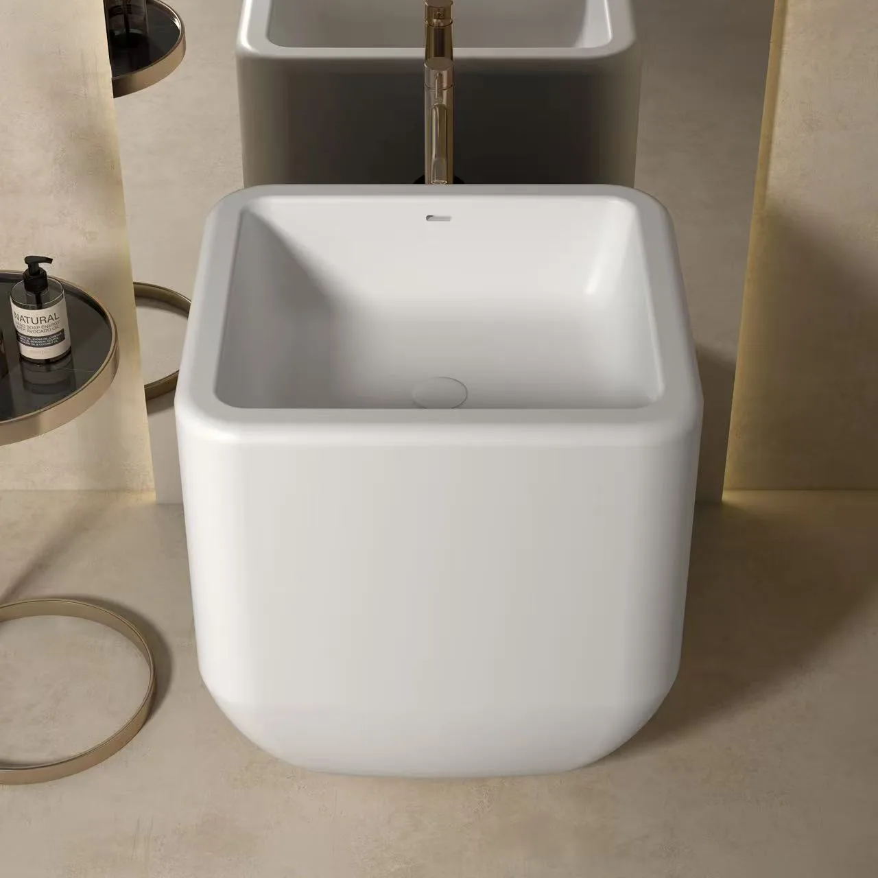 Monolithic flat-back square freestanding solid surface sink paired with a wall-mounted faucet and minimalist round mirror.