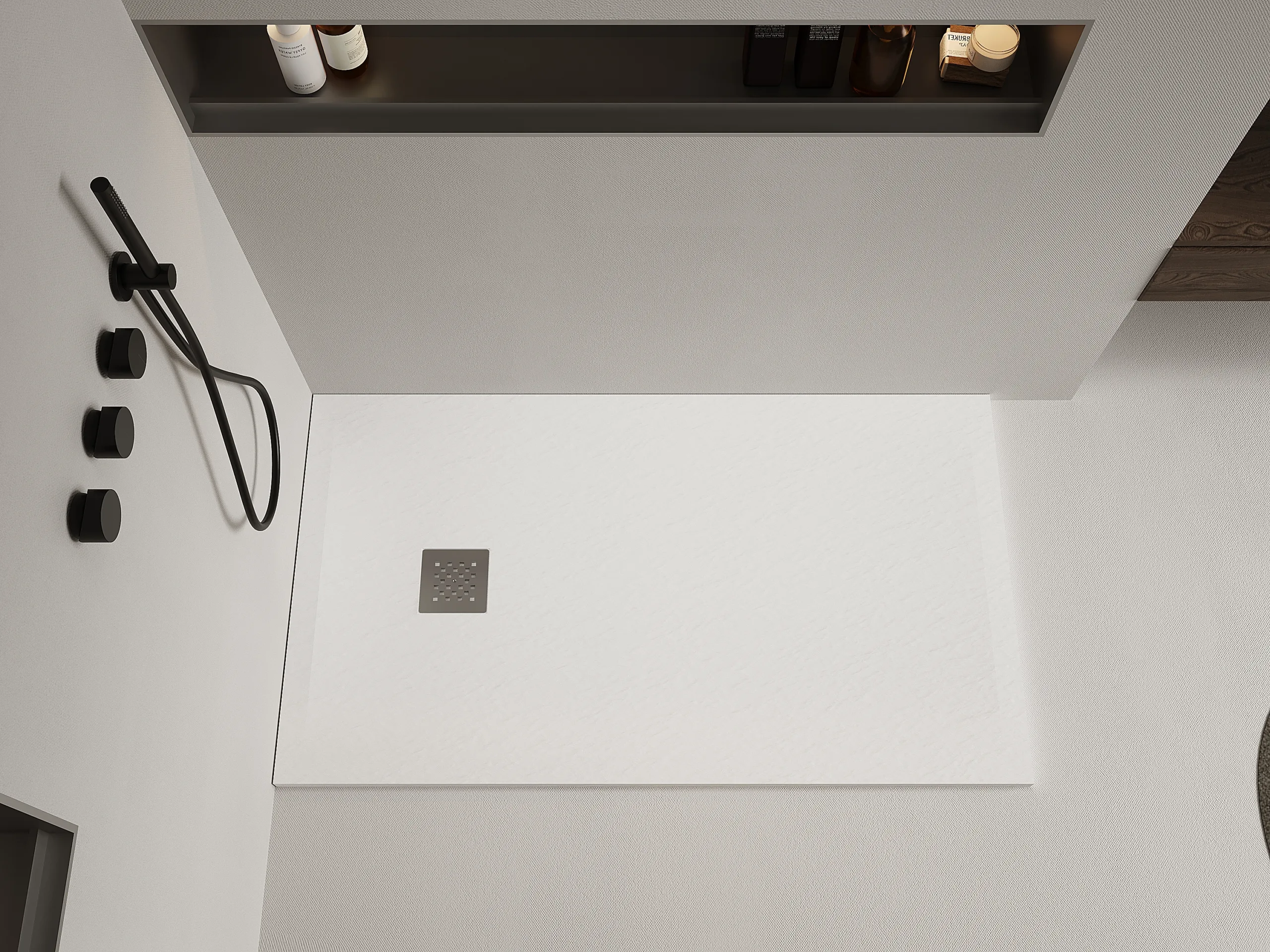 A highly durable matte white artificial stone shower base installed in a cohesive luxury commercial bathroom setting.