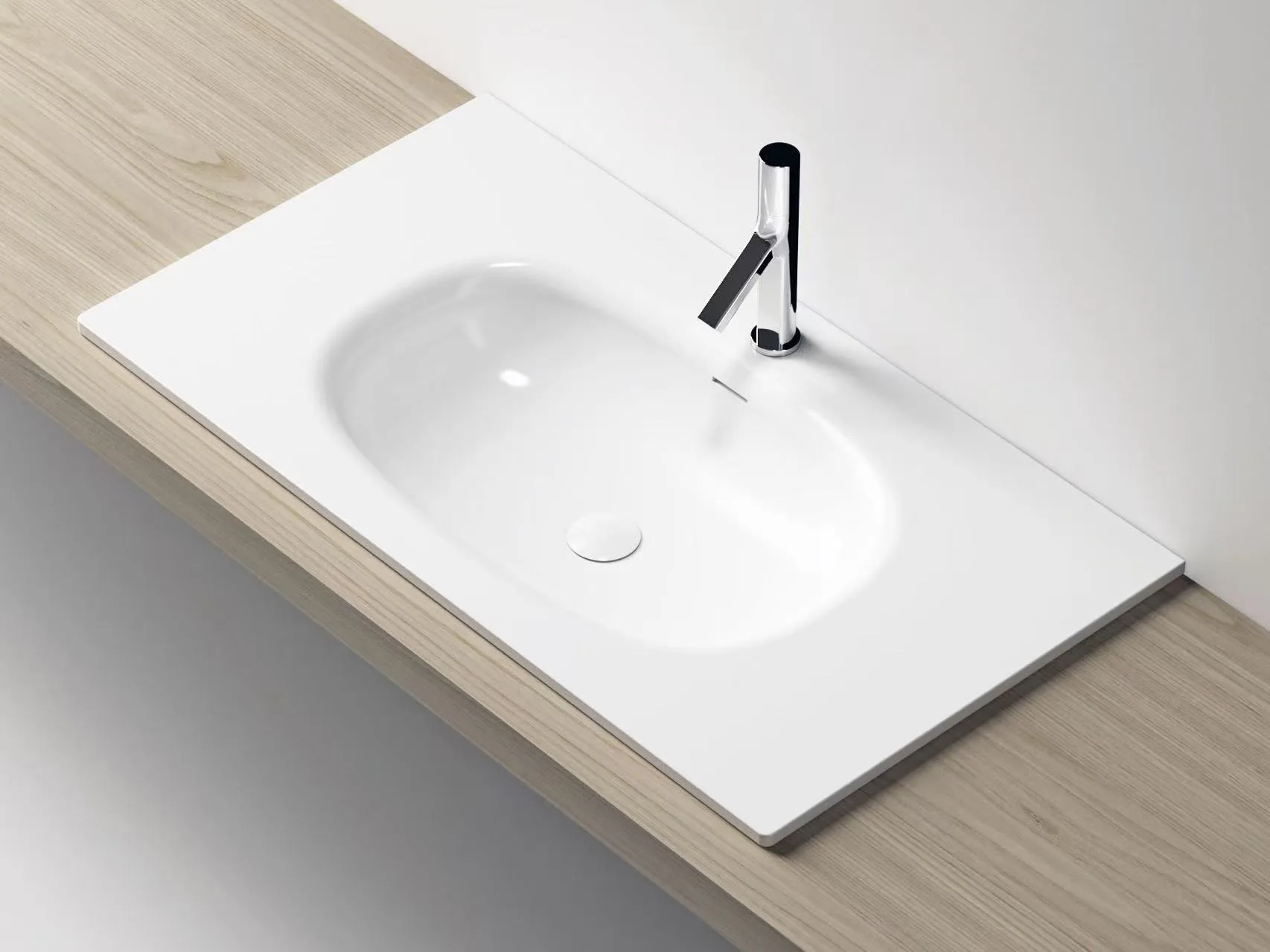 Close-up architectural detail of the seamless basin transition on a white cast marble single vanity top.