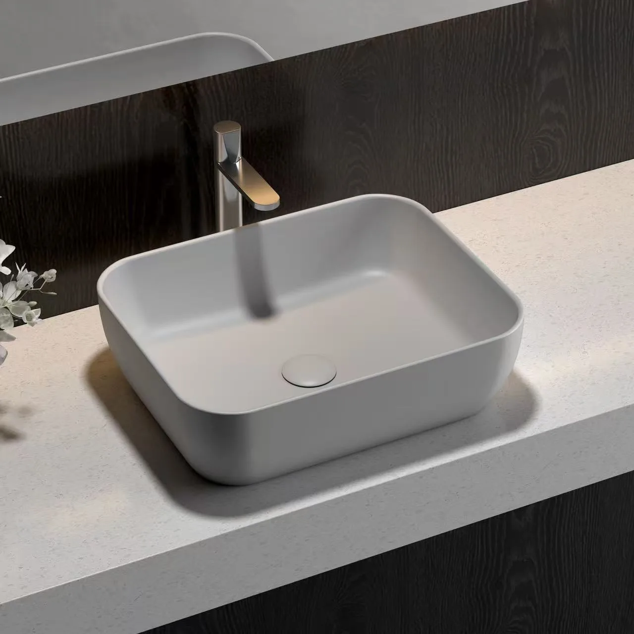 Minimalist light grey Rectangular Vessel Solid Surface Sink engineered for high impact resistance in hospitality restrooms.