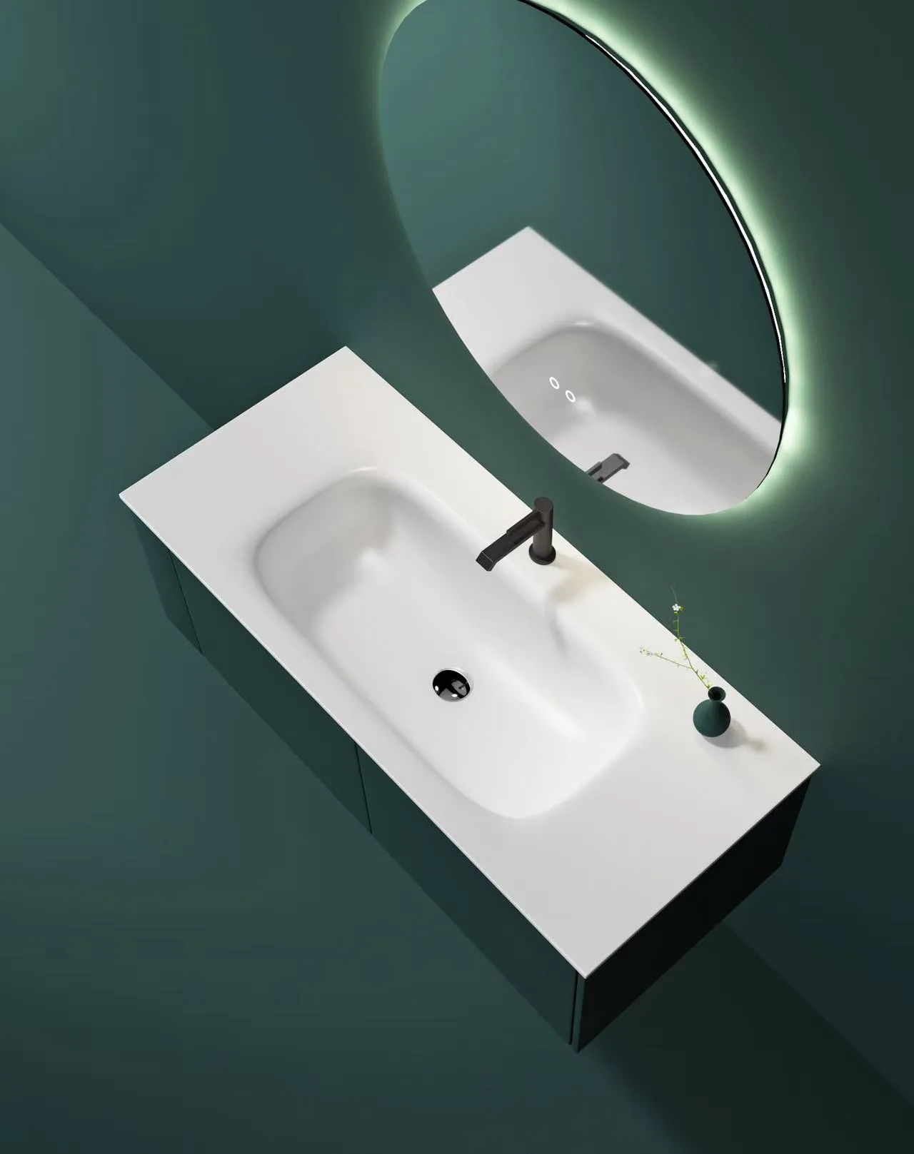 Top-down view of a white homogenous solid surface washbasin mounted on a dark green floating vanity cabinet.
