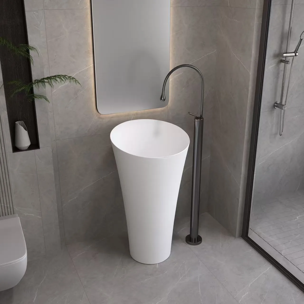 Architectural 1-piece round pedestal sink acting as a standalone geometric fixture beneath an illuminated round mirror.