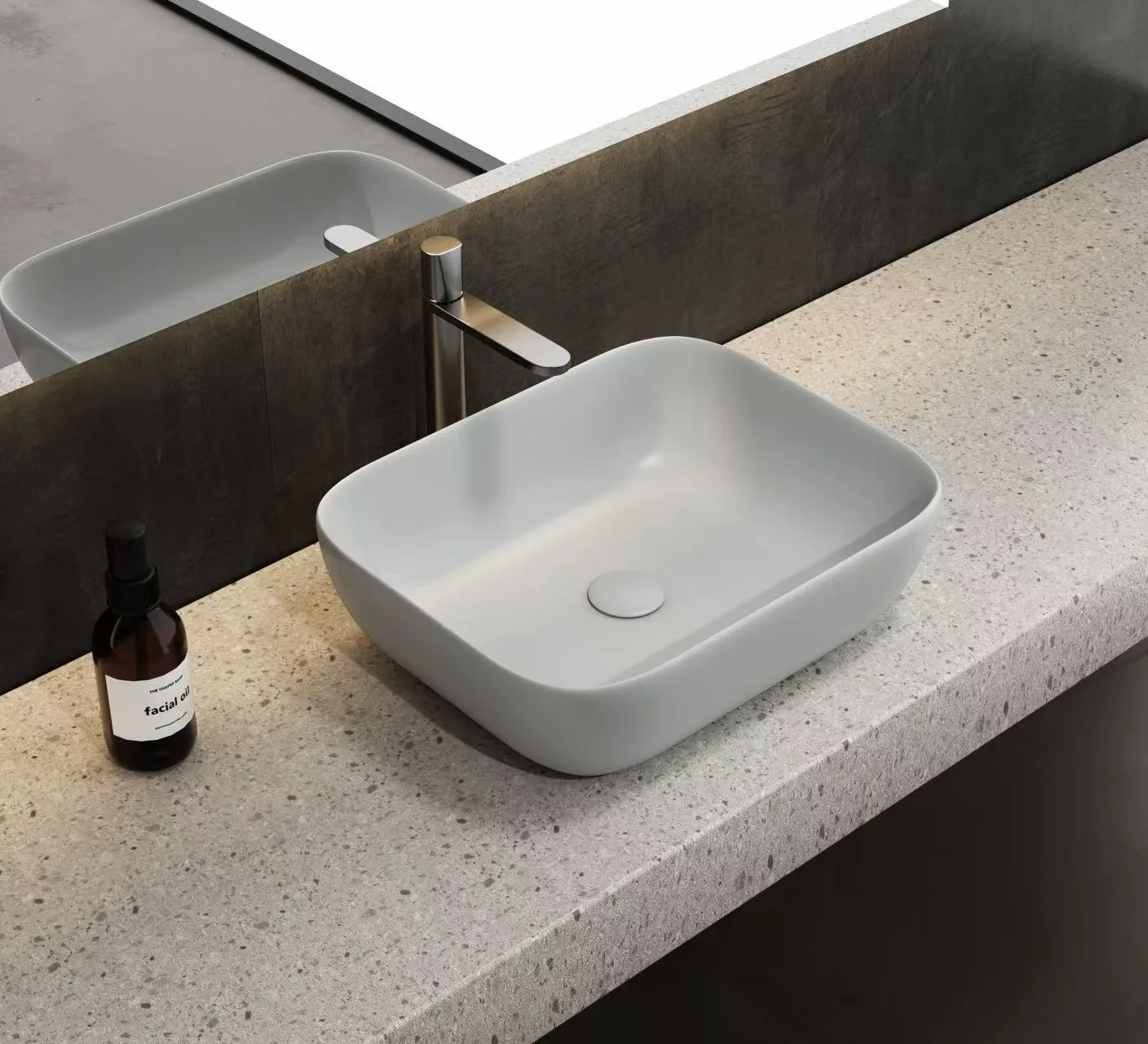 Matte dark grey Rectangular Vessel Solid Surface Sink perfectly complementing a terrazzo vanity cabinet setting.