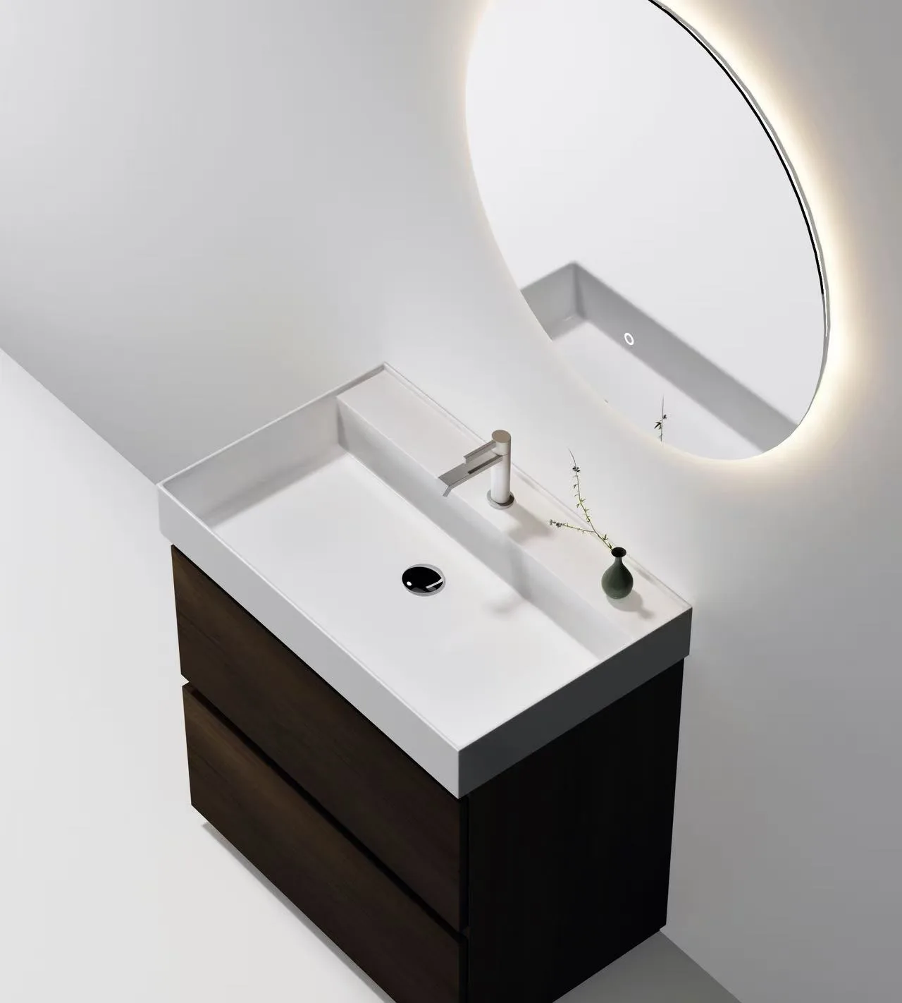 High-angle view of a seamless homogenous solid surface vanity basin integrated with a modern commercial cabinet.