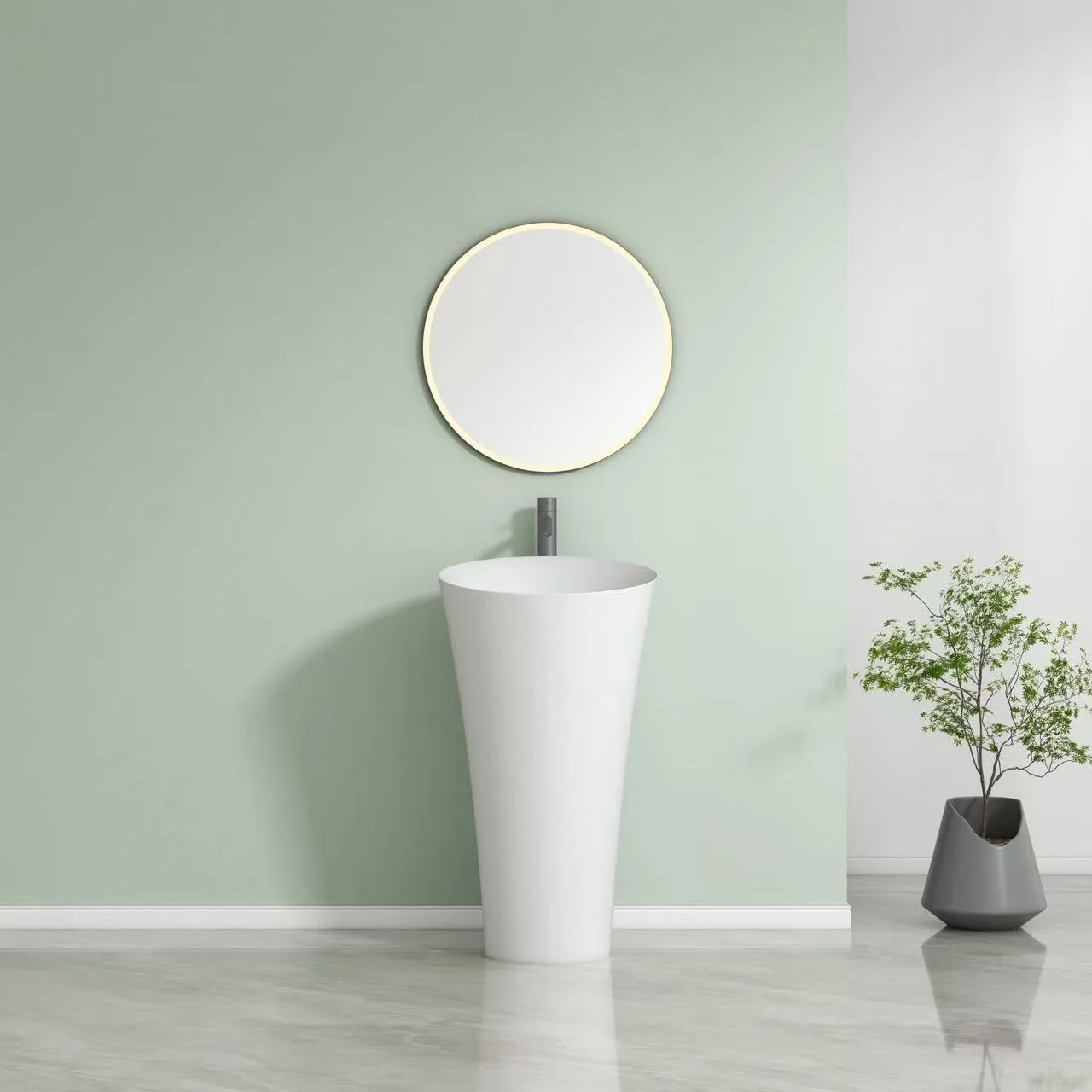 Top-down perspective of a homogenous solid surface round pedestal sink showing the 500mm wide commercial basin.