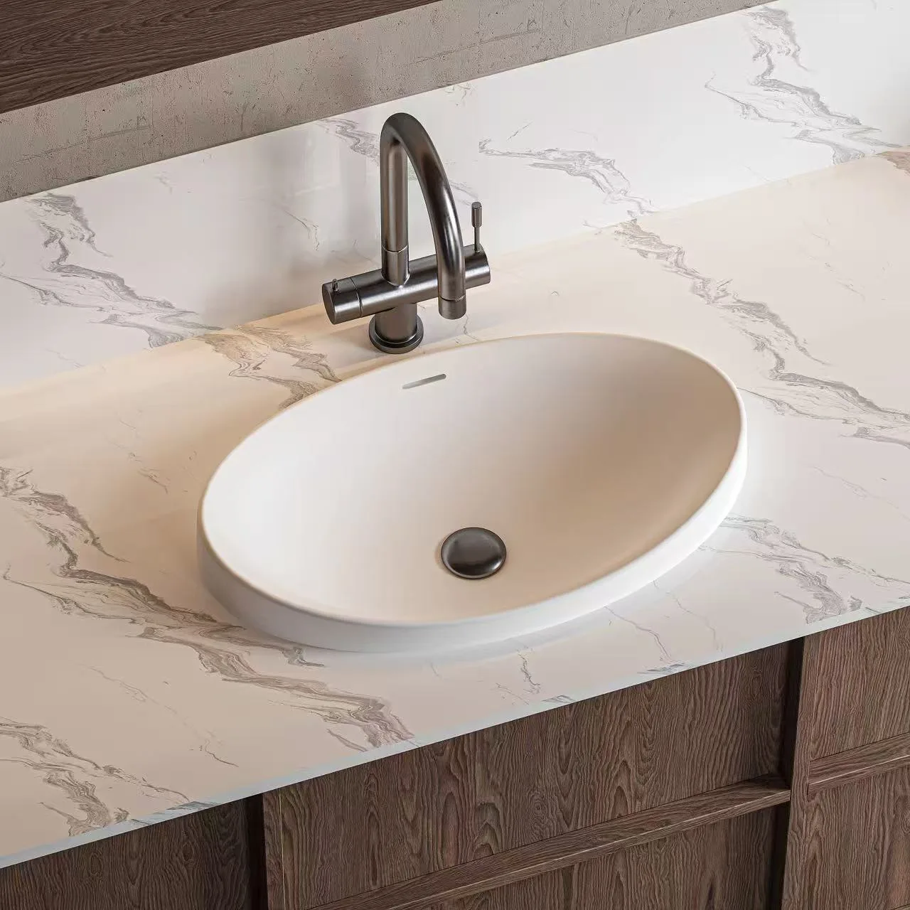 Taupe colored oval solid surface sink showcasing a seamless homogenous structure and elegant elongated proportions.
