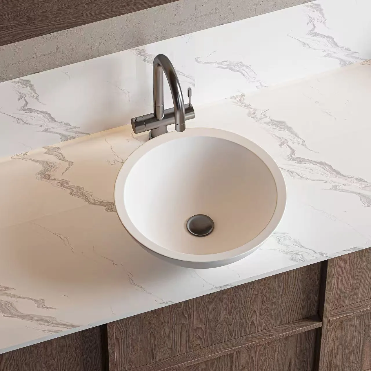 Commercial-grade white Round Solid Surface Vessel Sink acting as an architectural statement piece on a marble vanity.