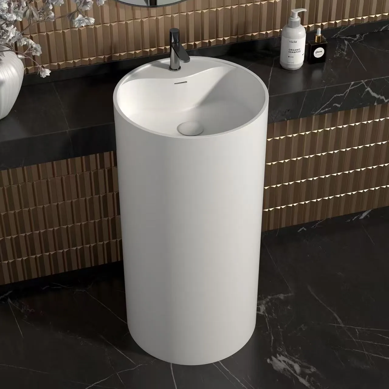 High-angle view of a homogenous modern pedestal sink showcasing the integrated commercial faucet installation ledge.