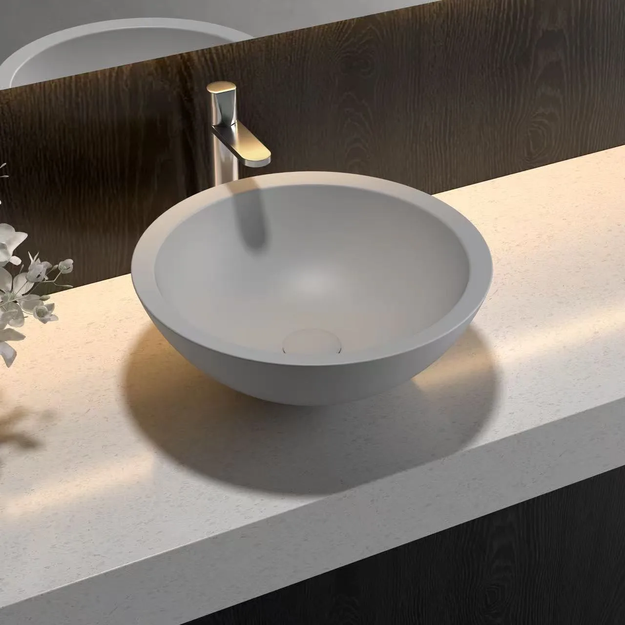 Light taupe Round Solid Surface Vessel Sink showing a seamless homogenous structure and soft curves for easy commercial maintenance.
