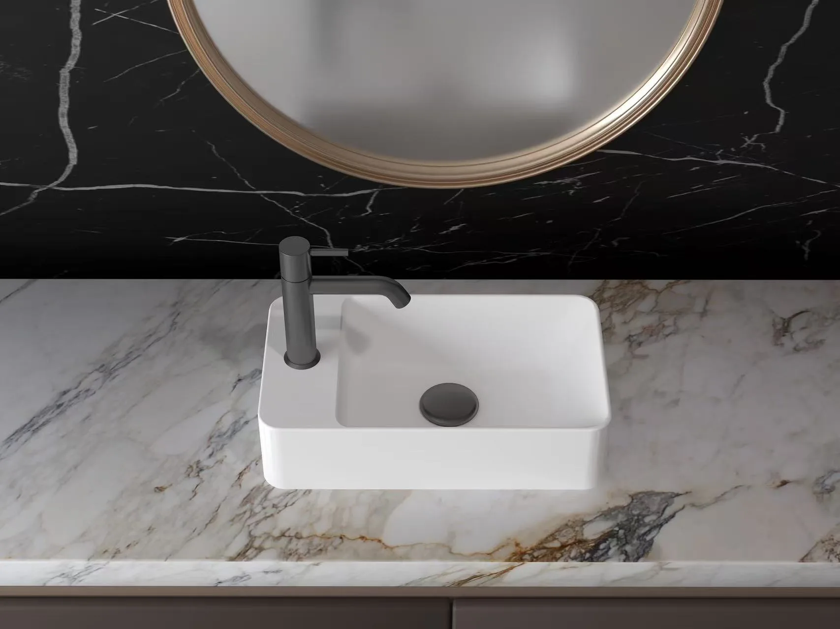 Top-angle view of a matte white solid surface rectangular vessel sink featuring a left-side faucet deck on a marble vanity.
