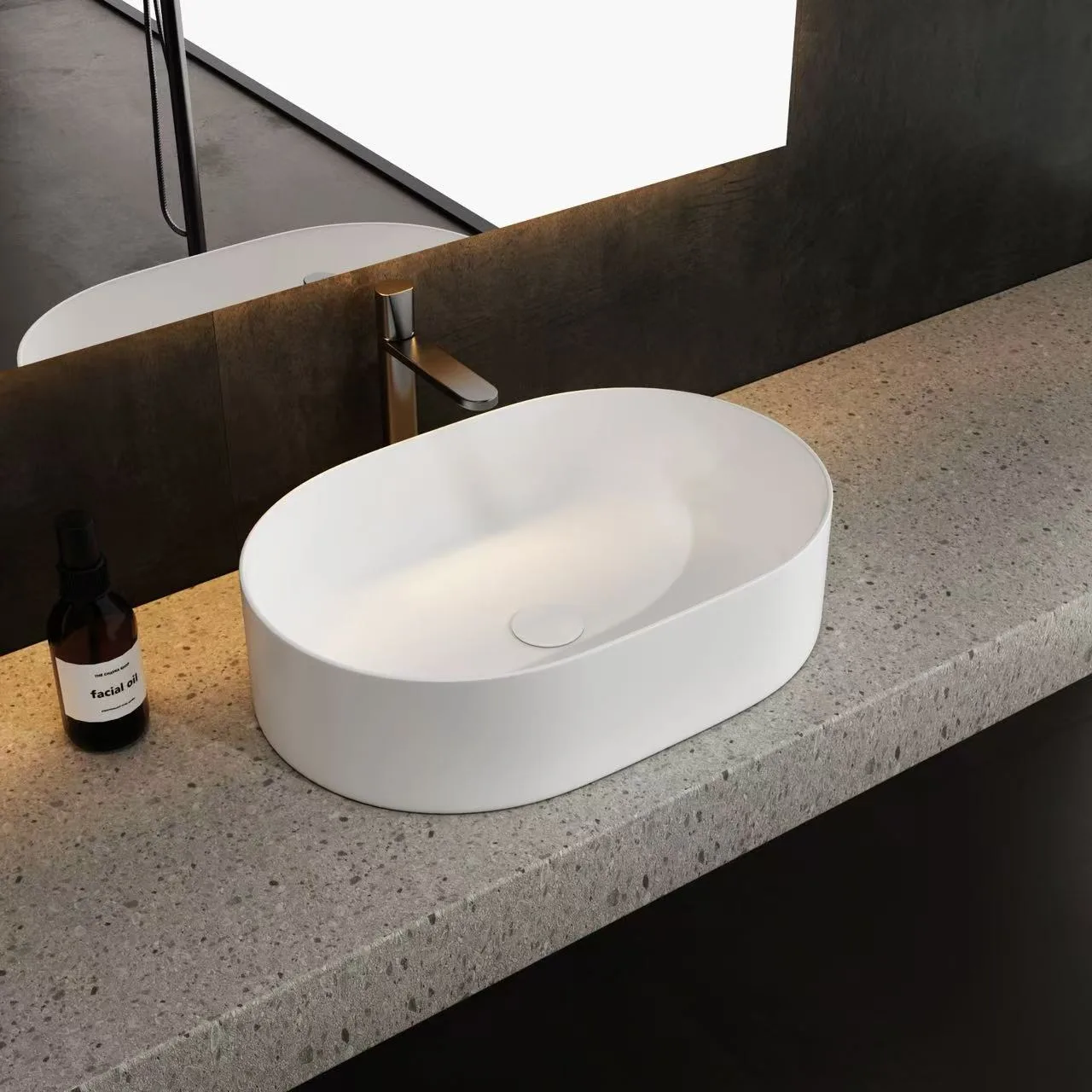 An elegant oval above-counter Artificial Stone Washbasin resting on a custom textured terrazzo vanity deck.