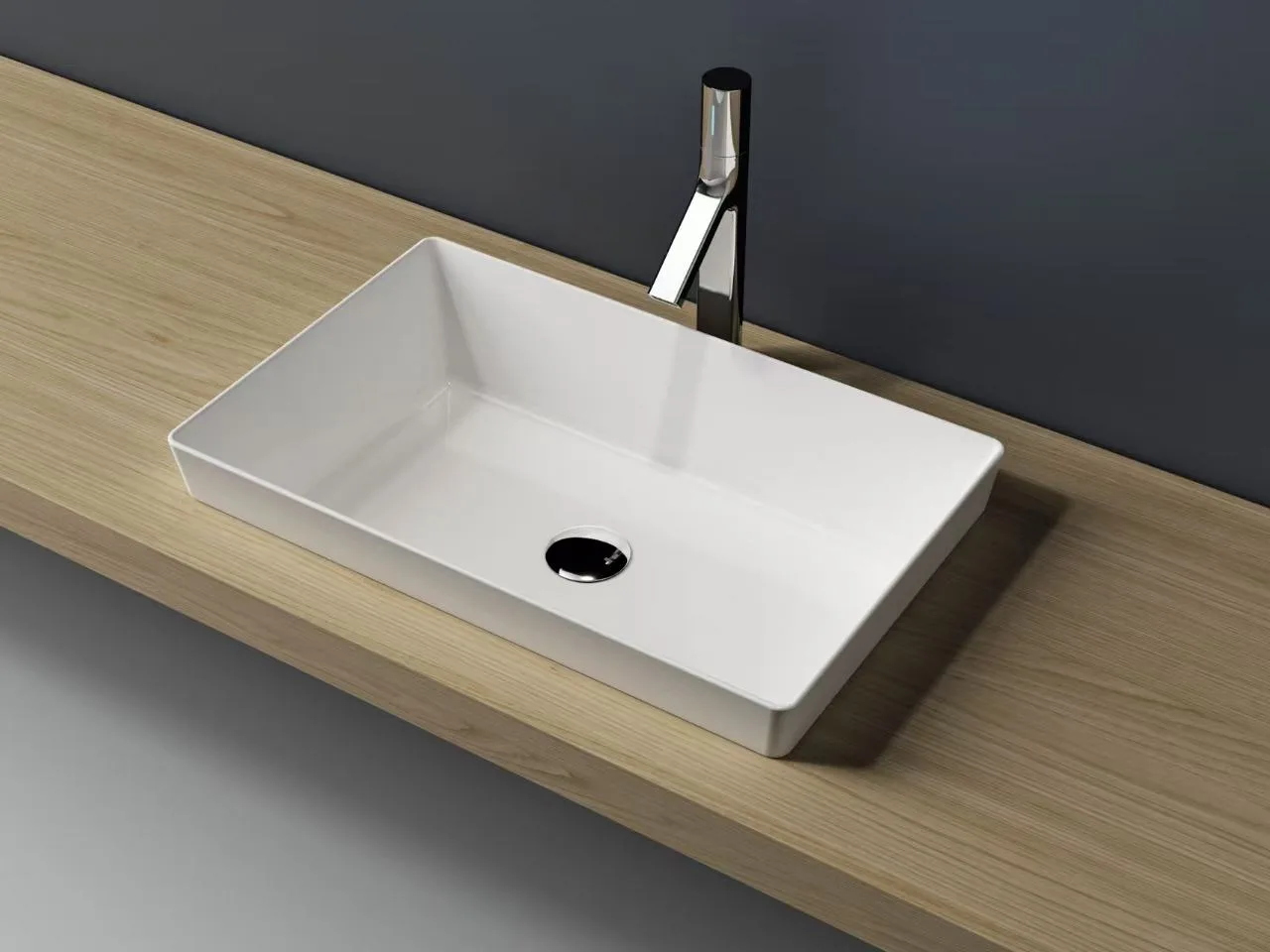 Rectangular solid surface thin-edge vessel sink in glossy white installed on a modern commercial washroom cabinet.