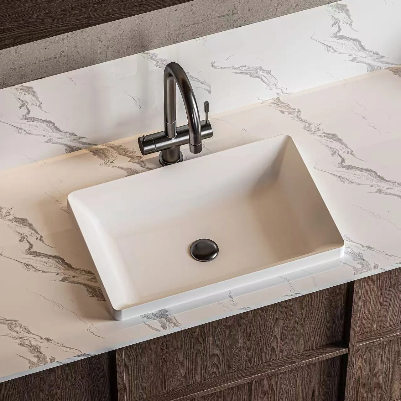 Elegant matte white solid surface thin-edge vessel sink paired with a matte black faucet on a luxury marble vanity.
