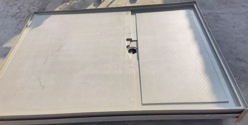 An industrial molded SMC tray blueprint featuring a notched L-shaped configuration compared against a solid Artificial Stone Shower Base.