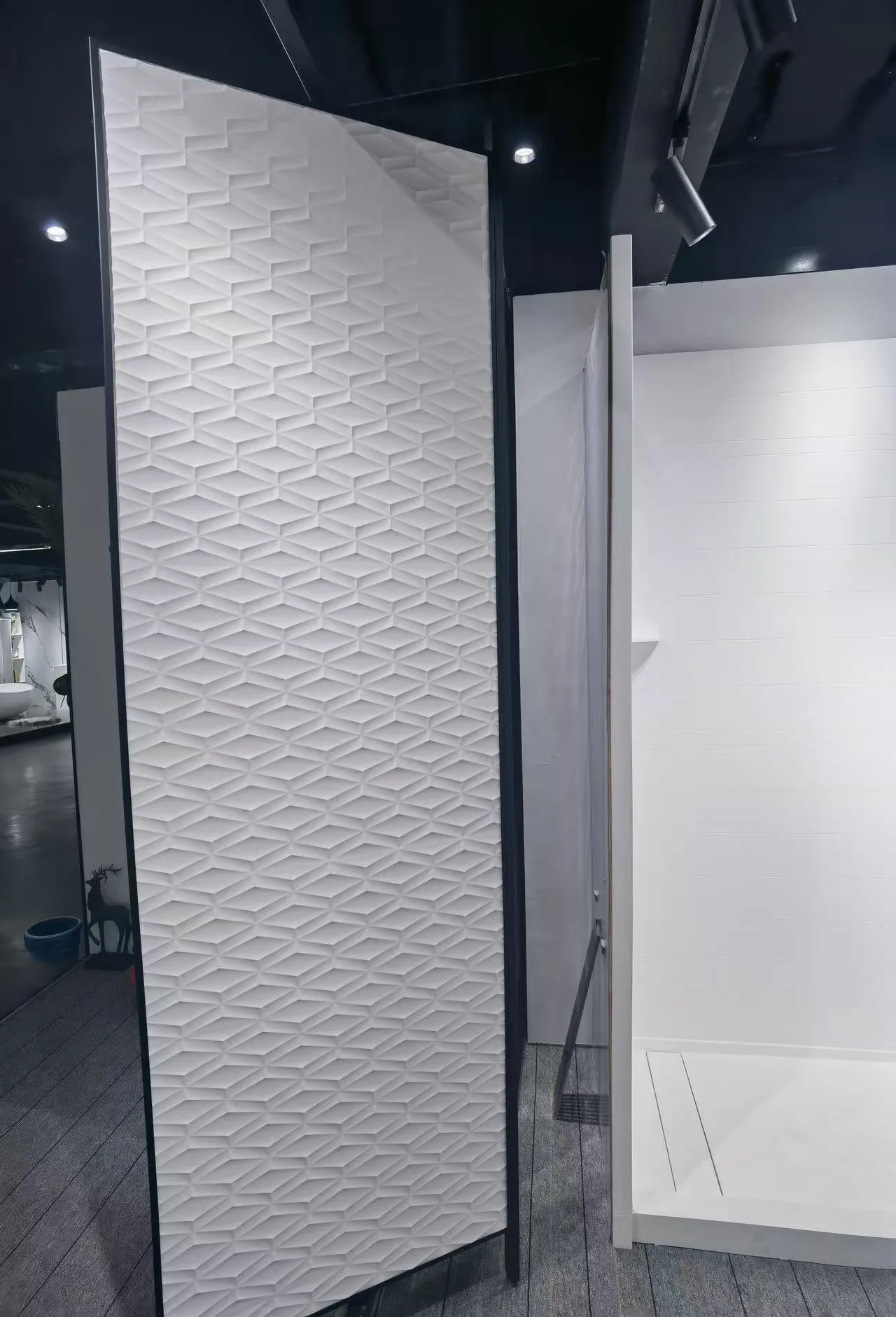 Close-up detail of a 100% grout-free waterproof corner joint using artificial stone shower panels.