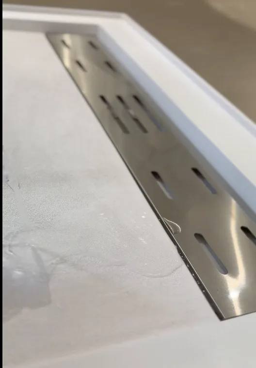 High-end hotel shower enclosure featuring an integrated Solid Surface Shower Wall Panel and low-profile matching base.[cite: 1]

Traditional tile relies entirely on the skill of the field installer and the quality of the secondary waterproofing membrane behind the backer board[cite: 1]...