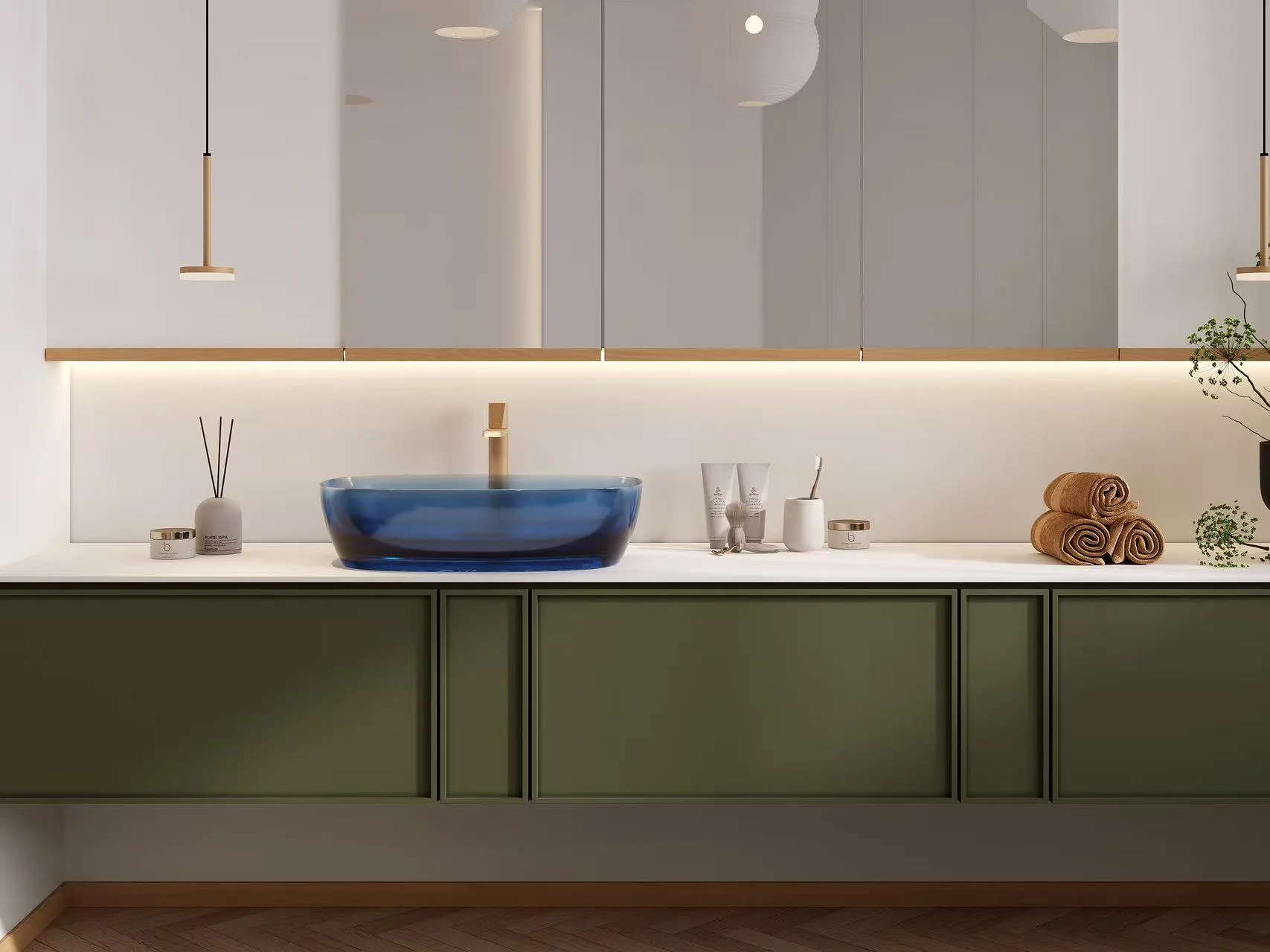Close-up detail of the smooth finish on colored glass bathroom vessel sinks.