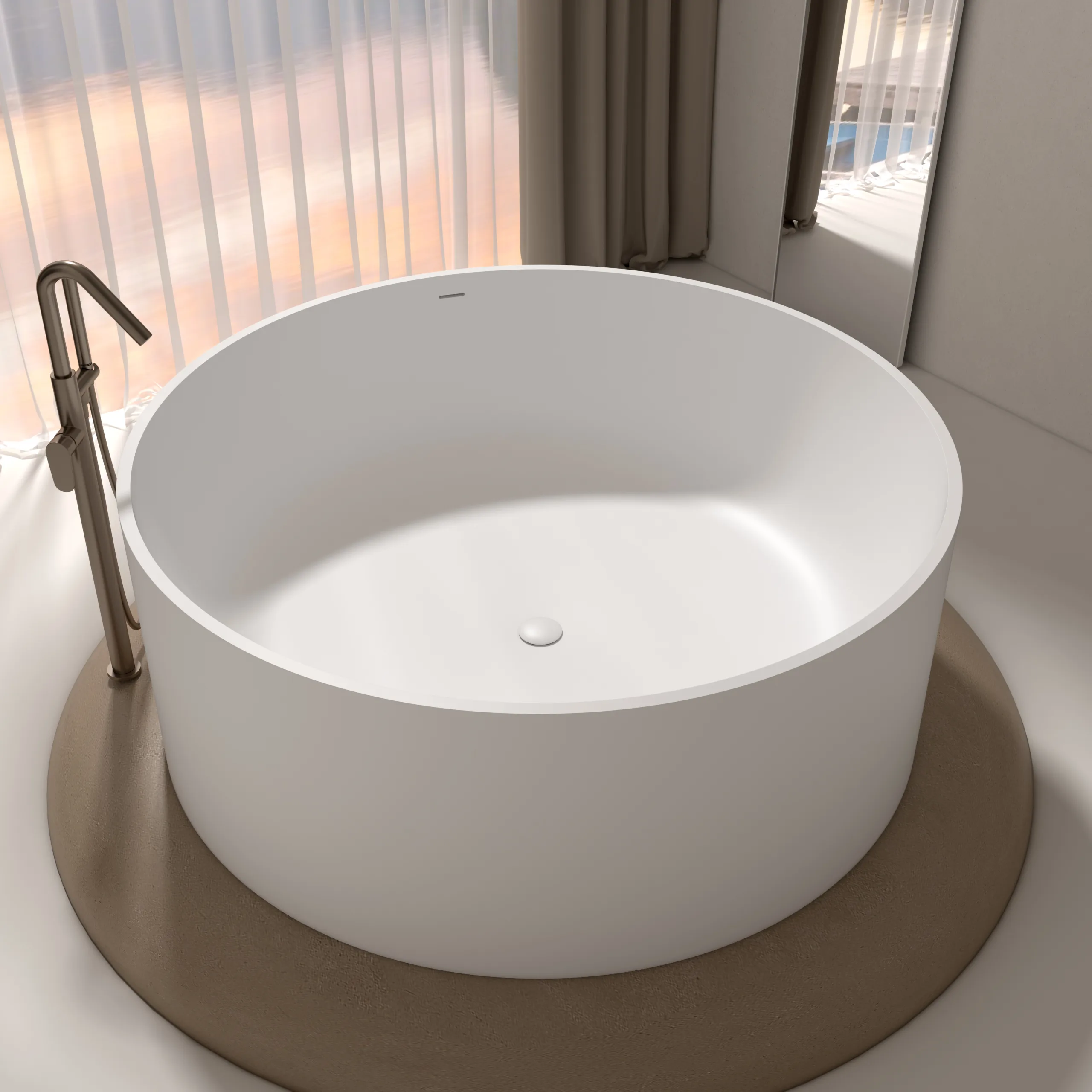 Eye-level straight-on view of a premium matte white round solid surface freestanding bathtub centered in front of a luxury floor-to-ceiling window setup.