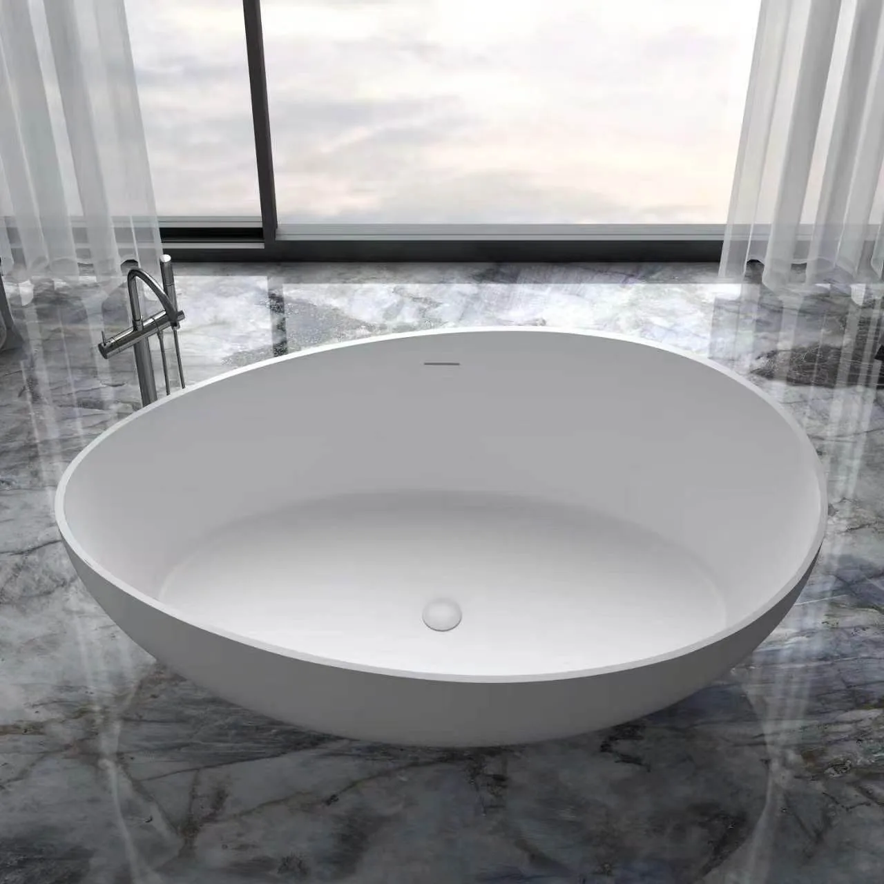 Direct high-angle view emphasizing the wide, symmetrical oval shape and sleek minimalist design of the matte white solid surface freestanding bathtub.