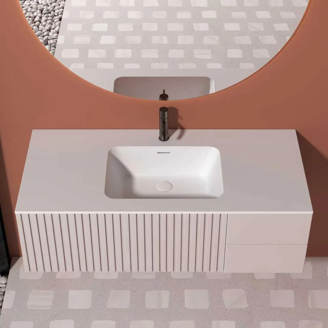 Direct top-down overhead view of the blush pink fluted floating solid surface bathroom vanity showcasing the smooth rectangular basin profile and asymmetric cabinet styling.