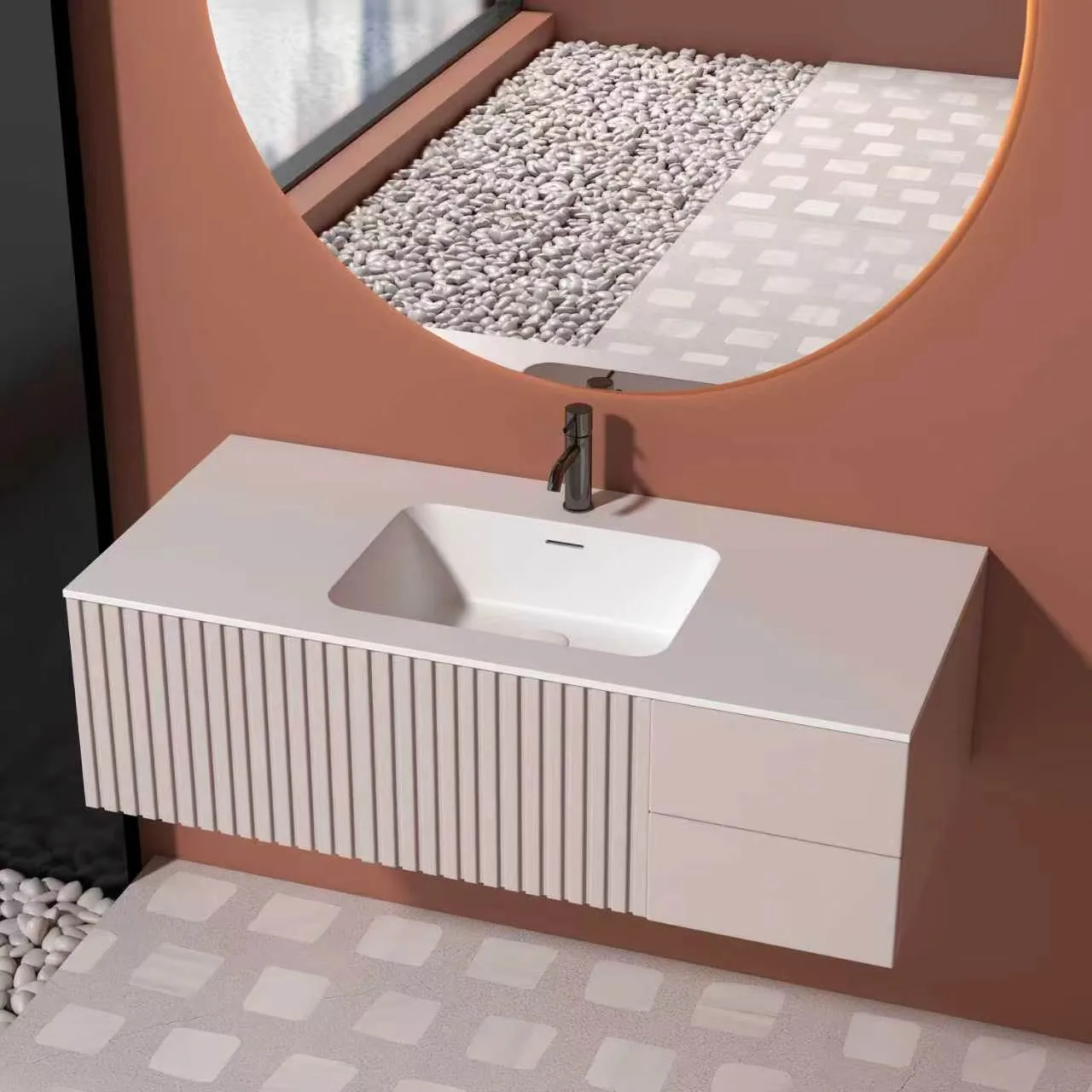 Perspective view showing the blush pink fluted floating solid surface bathroom vanity integrated into a luxury washroom interior with a large circular backlit mirror.