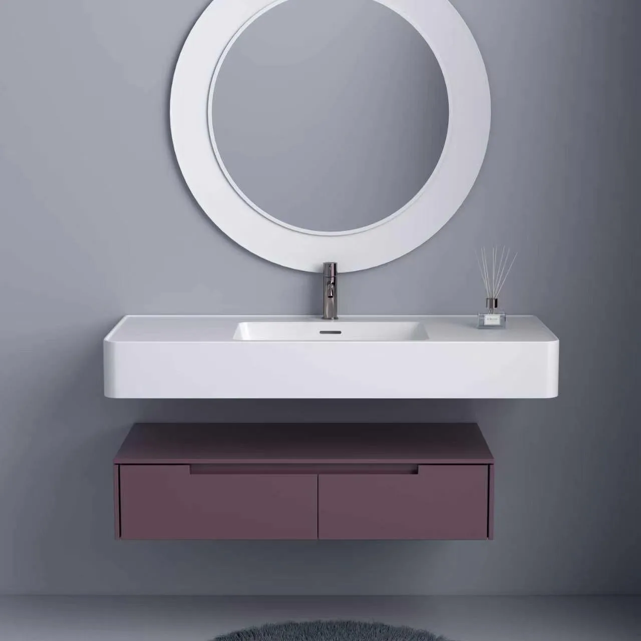 Front elevation view of the matte white solid surface floating vanity sink with an integrated basin, paired with a modern muted plum two-drawer storage cabinet underneath.