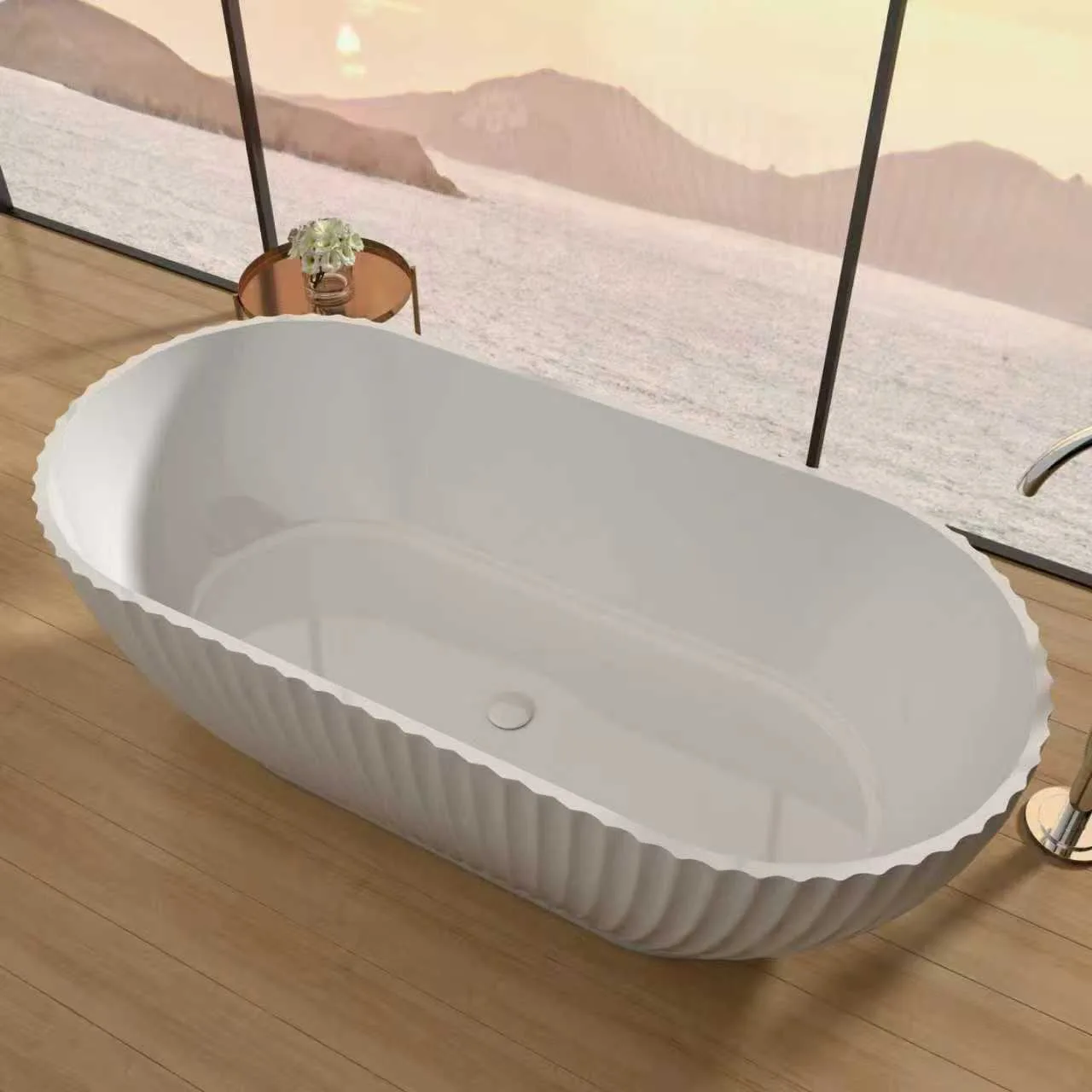 Luxury suite featuring a fluted freestanding solid surface bathtub with panoramic view