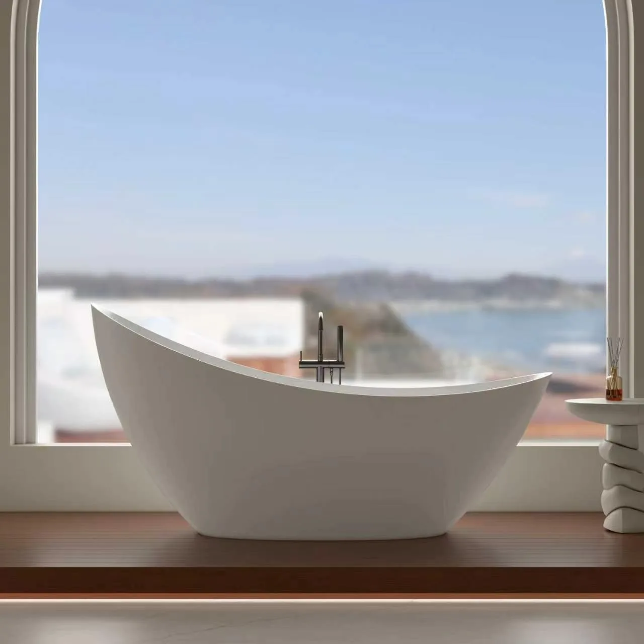 freestanding solid surface bathtub with ocean view in luxury resort suite