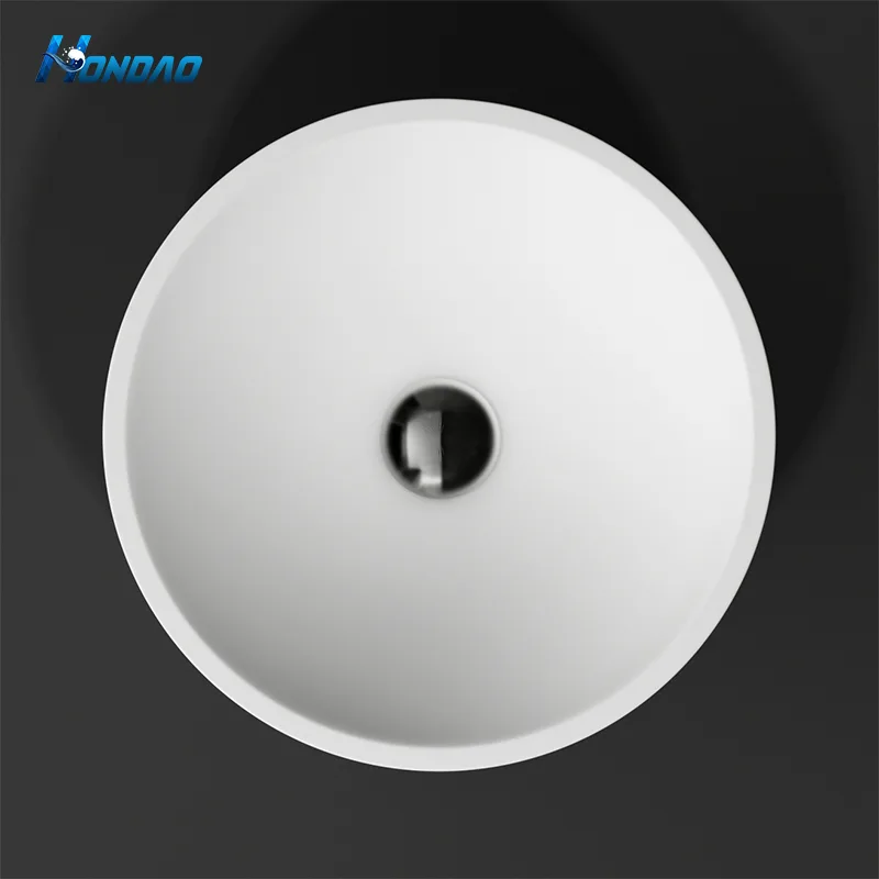Matte White Solid Surface Round Vessel Sink top-down view highlighting the symmetrical circular basin and centered drain outlet.Matte White Solid Surface Round Vessel Sink