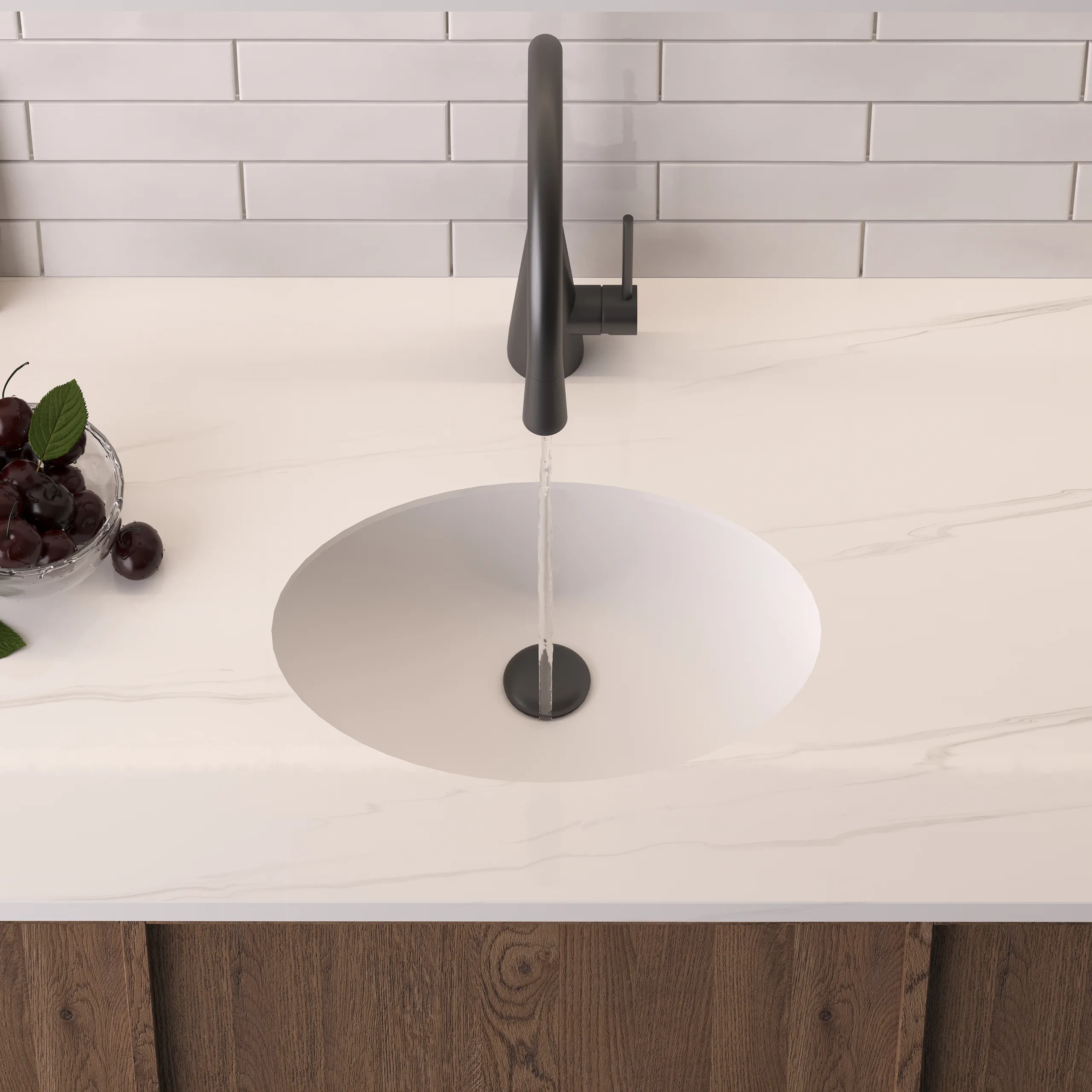 Matte White Solid Surface Oval Undermount Basin top-down view installed beneath a white marble vanity countertop with a matte black faucet.