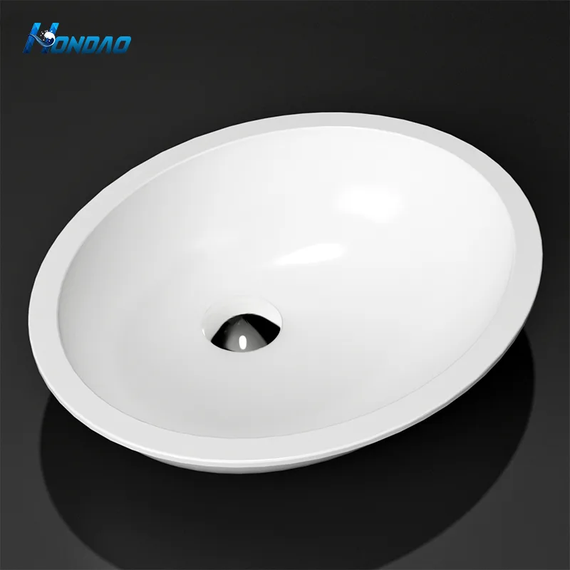 Matte White Solid Surface Elliptical Undermount Basin studio high-angle view showcasing smooth interior bowl contours and flat perimeter mounting flange.