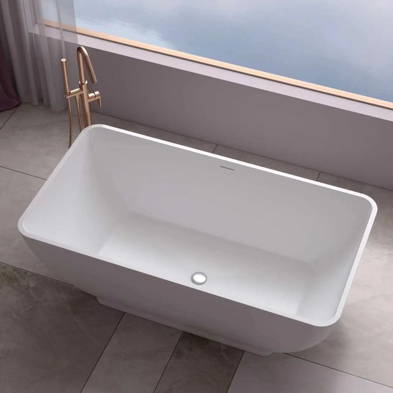 matte white freestanding solid surface bathtub showing non porous ergonomic interior