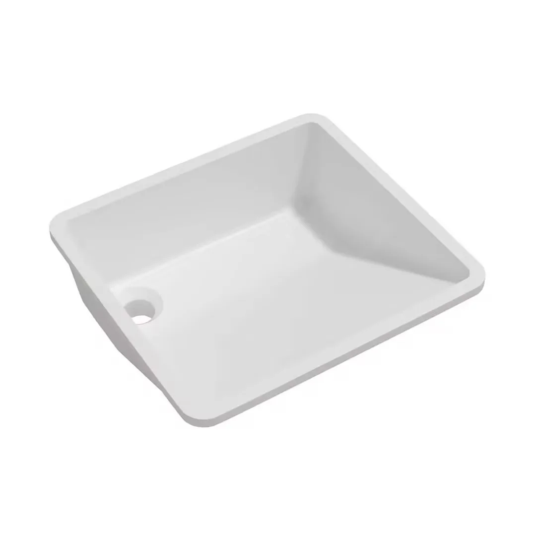 Matte White Solid Surface Ramp Undermount Basin studio high-angle perspective view showcasing the sloped drainage floor, flat mounting flange, and offset corner drain outlet.Matte White Solid Surface Ramp Undermount Basin
